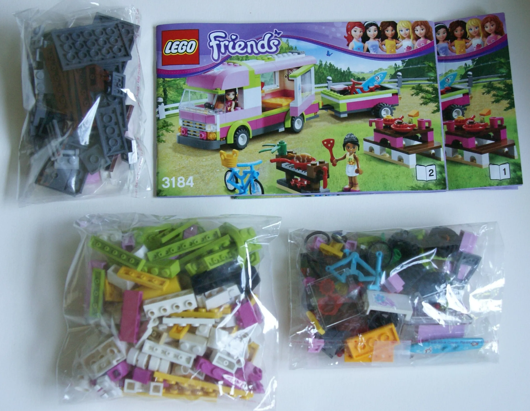 NOW RARE RETIRED LEGO FRIENDS KIT FROM 2012 Adventure Camper, Set 3184, Complete with 2 Minifigures, Olivia & Nicole, 2 Instructions’ Booklets & Box included (325 PIECES) 2 MINIFIGURES, 2 BIKES, SURFBOARD, STICKERS ETC...